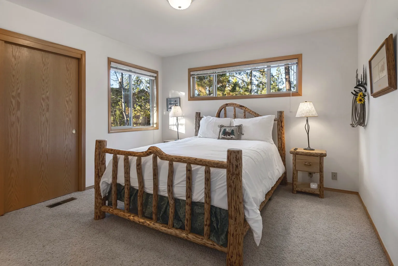 The Bachelor Room: log-frame queen bed with white bedding