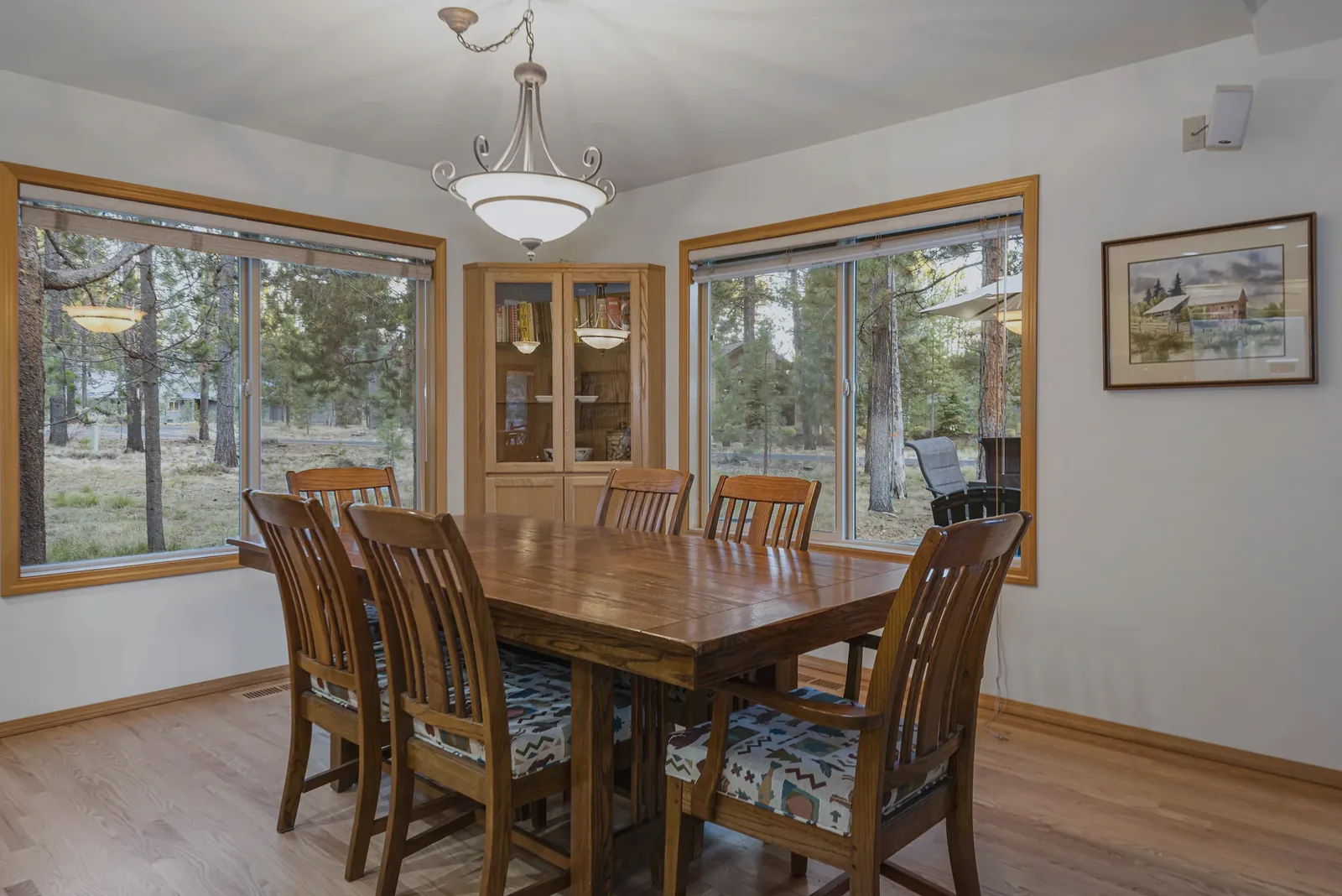 Dining table with forest views on two sides